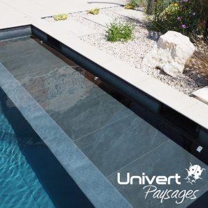 Aménagement paysager Divonne Pays-de-gex Univert Coccinelle piscine terrasse grès cérame abri mur plantations fruitiers arbres fleurs jardin